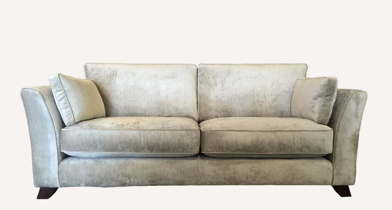 A light beige velvet loveseat sofa with two back cushions, two seat cushions, and two matching throw pillows, shown against a plain white background.