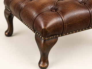 Antique Brown Chesterfield Queen Anne Footstool, close-up of the buttoned top and cabriole leg