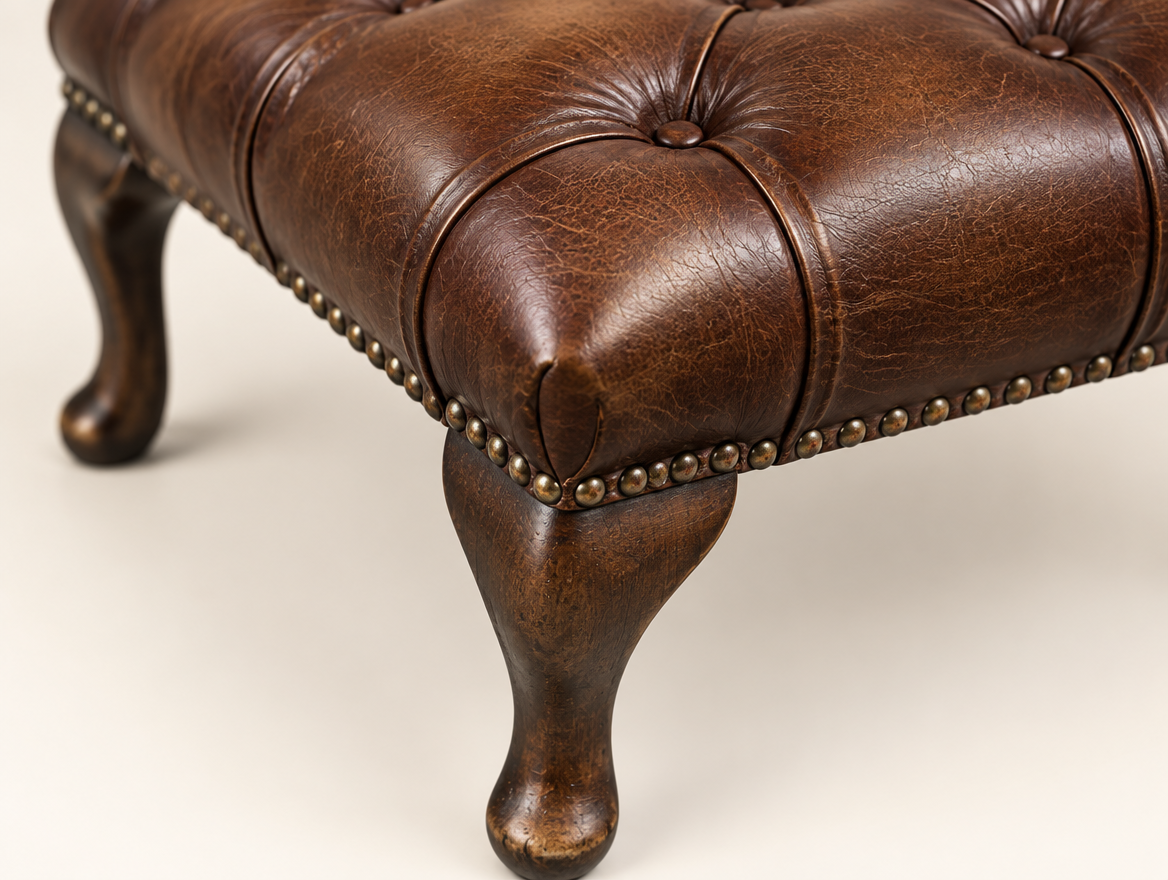 Antique Brown Chesterfield Queen Anne Footstool, close-up of the buttoned top and cabriole leg