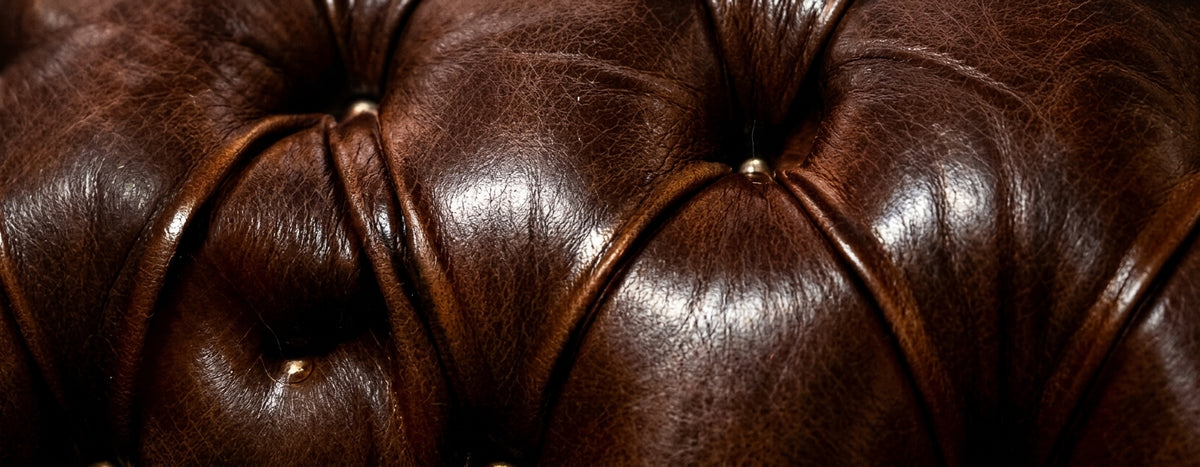 Close-up of handcrafted deep-buttoned leather