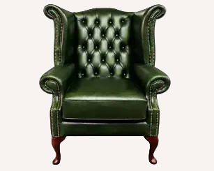 A classic green leather wingback armchair with button tufting, rolled arms, nailhead trim, and dark wood legs, shown against a plain white background.